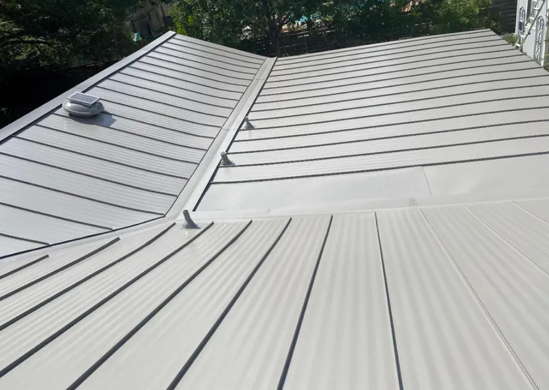 Solar attic fan installed on a metal roof for Roof Ventilation in Blythewood